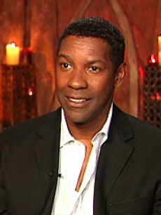 Denzel smiles during an Access interview