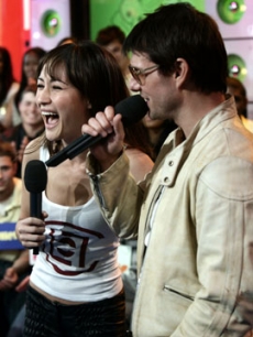 Tom Cruise joking with co-star Maggie Q