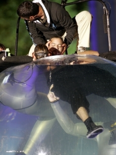Blaine is brought to the surface by divers