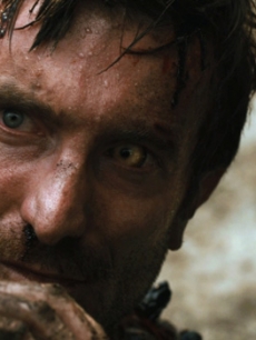 Sharlto Copley hides out in “District 9”