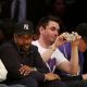 DJ AM, sitting next to Denzel Washington, takes a shot at the Lakers game in LA on May 7, 2008