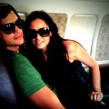 Ashton Kutcher and Demi Moore keep each other safe during a brief flight scare on August 7, 2009