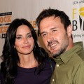 Courteney Cox-Arquette alongside husband David Arquette arrive at the Rock A Little, Feed A Lot benefit concert in Los Angeles on September 29, 2009
