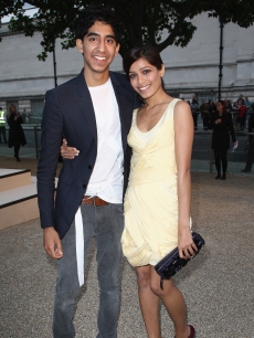 Dev Patel and Freida Pinto attend the Burberry show at London Fashion Week, Sept. 22, 2009