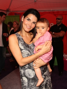 Angie Harmon and her daughter Emery Hope Sehorn attend Huggies Little Movers Adventure Zone And Live Auction at Madison Square Park on September 22, 2009