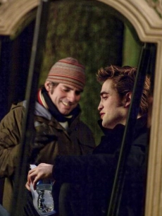 Director Chris Weitz and Robert Pattinson talk during scene blocking on the ‘New Moon,’ set on April 23, 2009