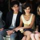Dev Patel and Freida Pinto hold hands at the Burberry Prorsum Spring/Summer 2010 Show during London Fashion Week on September 22, 2009 in London, England