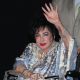 Elizabeth Taylor waves at the cameras at the 27th Annual Macy’s Passport benefit at the Barker Hangar in Santa Monica, Calif., on September 24, 2009