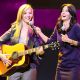 Lisa Kudrow performs ‘Smelly Cat’ with Courteney Cox onstage during the ‘Rock A Little Feed A Lot’ Benefit Concert held at Club Nokia on September 29, 2009 in Los Angeles, California