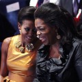 Michelle Obama shares a laugh with Oprah Winfrey at the opening Ceremony of the 121st IOC Session in Copenhagen, Denmark on October 1, 2009