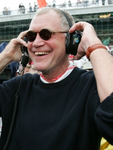 David Letterman, co-owner of the #15 Rahal-Letterman ArgentPioneer G Force Honda of Buddy Rice, smiles when the rain started to fall and cause the race to be shortened and Rice to win the 88th running of the Ind