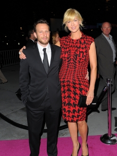 A very pregnant Jenna Elfman and her husband Bodhi Elfman pose for cameras at the Inaugural Gala of the Los Angeles Philharmonic at the Walt Disney Concert Hall in Los Angeles on October 8, 2009