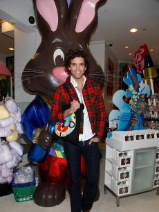 British pop singer Mika visits Dylan’s Candy Bar, where he poses in front of a giant chocolate bunny, NYC, Oct. 16, 2009