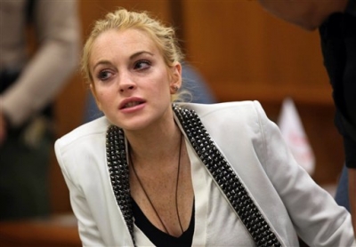 Lindsay Lohan takes a seat in court in Beverly Hills on October 16, 2009