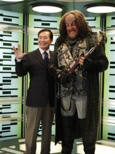 George Takei gives a live long and prosper gesture as he stands next to Klingon from ‘Star Trek The Next Generation’ in the transporter room in the Tech Museum in San Jose, Calif. on October 20, 2009