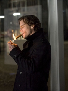 Matt Bomer lights a cigar during an episode of ‘White Collar’