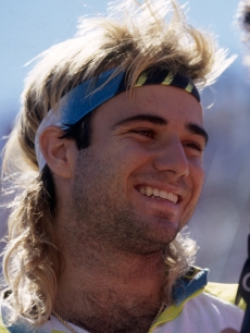 Andre Agassi talks to the media during the 1990 U.S. Open held in September 1990 at Flushing Meadows, in New York