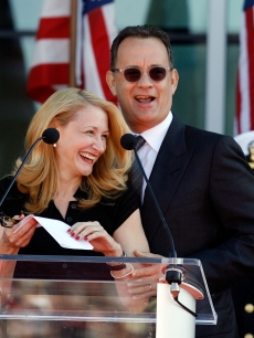 Patricia Clarkson and Tom Hanks share a laugh during the National World War II Museum Dedication Ceremony in New Orleans, Louisiana on November 6, 2009 