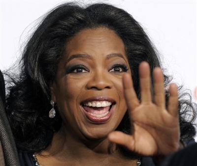 Oprah Winfrey, executive producer of ‘Precious: Based on the Novel ‘Push’ by Sapphire,’ waves to photographers at the premiere of the film at AFI Fest 2009 in Los Angeles, Sunday, Nov. 1, 2009. 