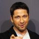 Gerard Butler poses during a photocall for his latest movie ‘Law abiding citizen’ in Berlin on November 2, 2009