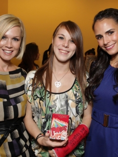 Jennie Garth and Jordana Brewster pose with former Children’s Hospital LA patient Briana at the Lollipop Theater Network’s launch party for ‘La Collection Lollipop’ by Lancome on November 17, 2009 in LA