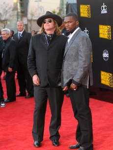 Val Kilmer and 50 Cent make an odd couple at the 2009 American Music Awards at the Nokia Theatre L.A. Live in LA on November 22, 2009