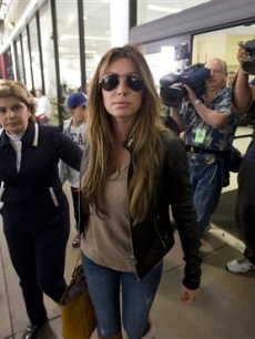 Rachel Uchitel arrives from New York at LAX flanked by her attorney, Gloria Allred, Nov. 29, 2009