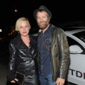 Patricia Arquette and a shoeless Thomas Jane arrive in an Audi TDI to the Galerie Half Grand Opening Party, Los Angeles, December 10, 2009