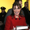 Sarah Palin signs her new book, ‘Going Rogue’ for a customer at a Barnes & Noble bookstore, Grand Rapids, Michigan, November 18, 2009
