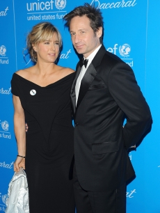 Tea Leoni and David Duchovny look happy together at the 2009 UNICEF Snowflake Ball at Cipriani 42nd Street in NYC on December 2, 2009