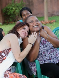Debra Messing, left, visits members of the gay community in Harare, Uganda, Tuesday, Dec. 8, 2009. Messing who is best known for her role on NBC’s Emmy Award winning comedy series, ‘Will and Grace’ is in Zimbabwe to attend an HIV and AIDS Awards ceremony and is also set to visit a number of HIV prevention and treatment centers in the country.