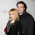 Brittany Murphy and husband Simon Monjack get close backstage at the Max Azaria show at Bryant Park during Mercedes-Benz Fashion Week in NYC on February 4, 2008