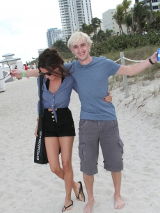 Tom Felton, who Tweeted he has to stay pale for ‘Harry Potter,’ steps out with a girlfriend in Miami, December 30, 2009