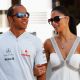 Lewis Hamilton and Nicole Scherzinger of the Pussycat Dolls walk in the paddock before the European Formula One Grand Prix at the Valencia Street Circuit on August 23, 2009, in Valencia, Spain