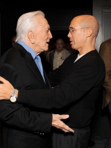 Jeffrey Katzenberg shakes the hand of Kirk Douglas, someone he calls both a legend and a mentor, at the Motion Picture & Television Fund’s LA premiere of “Before I Forget”