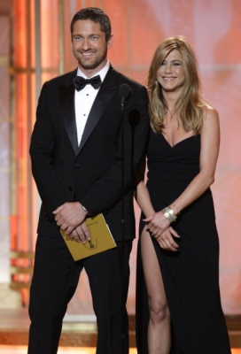 Gerard Butler shares a laugh with Jennifer Aniston on the Golden Globe stage, Beverly Hills, Jan. 17, 2010