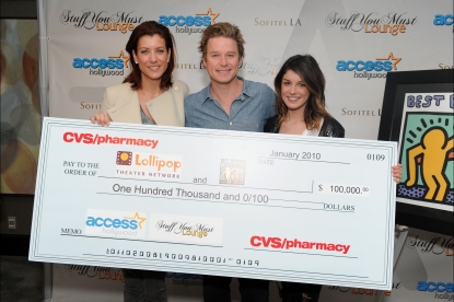 Kate Walsh and Shenae Grimes present the CVS Pharmacy donation to Access Hollywood’s Billy Bush and the Lollipop Theater Network at Access’ 4th Annual ‘Stuff You Must…' Golden Globes Gifting Lounge at the Sofitel Hotel in LA on January 16, 2010