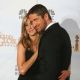 Jennifer Aniston and Gerard Bulter get cozy backstage in the photo room at the 67th Annual Golden Globe Awards at the Beverly Hilton Hotel in Beverly Hills, California, January 17, 2010