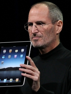 Apple Inc. CEO Steve Jobs holds up the new iPad as he speaks during an Apple Special Event at Yerba Buena Center for the Arts January 27, 2010 in San Francisco, Calif.
