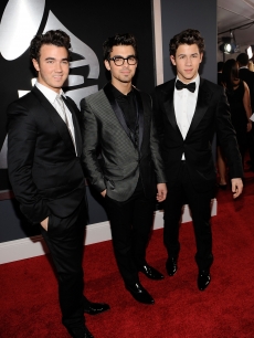 Kevin Jonas, Joe Jonas and Nick Jonas of the Jonas Brothers arrives at the 52nd Annual Grammy Awards held at Staples Center on January 31, 2010 in Los Angeles, California