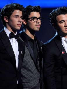 Nick Jonas, Joe Jonas, and Kevin Jonas of the Jonas Brothers onstage during the 52nd Annual Grammy Awards held at Staples Center on January 31, 2010 in Los Angeles, California