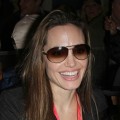 Angelina Jolie smiles as she leaves Super Bowl XLIV on February 7, 2010 in Miami, Florida