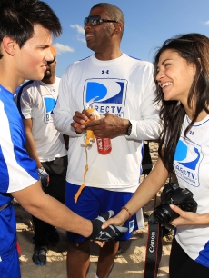 ‘Twilight’ star Taylor Lautner meets ‘Gossip Girl’ beauty Jessica Szohr at the DIRECTV Celebrity Beach Bowl on February 6, 2010 in Miami Beach, Florida
