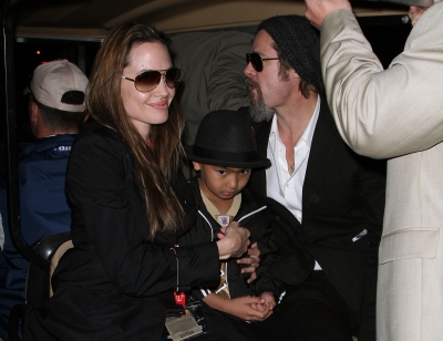 Angelina Jolie, son Maddox and Brad Pitt make it a family affair at Super Bowl XLIV at the Sun Life Stadium in Miami Gardens, Fla., on February 7, 2010