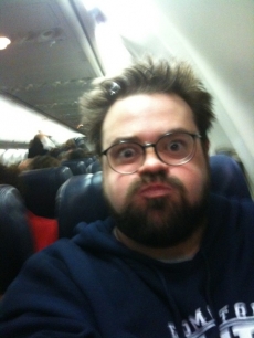 Kevin Smith makes an unhappy face on a Southwest flight on February 13, 2010