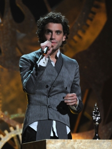 Pop singer Mika stands at the podium at the Brit Awards, London, February 16, 2010