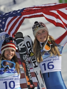 Julia Mancuso and Lindsey Vonn celebrate their silver and gold medals in Women’s Downhill skiing at the Winter Olympics in Vancouver on Feb. 17, 2010