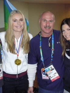 Access crewmembers Buddy S. and Wally H. pose with gold medalist Lindsey Vonn and silver medalist Julia Mancuso at the 2010 Winter Olympics held in Vancouver, Canada, February 2010    