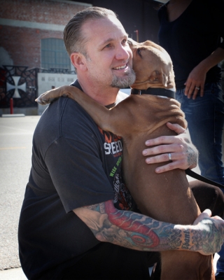Jesse James smiles with his returned dog, Cinnabun, in Long Beach, Calif., on February 17, 2010
