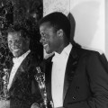 Sidney Poitier poses with his Oscar for Best Actor backstage at the Academy Awards on April 13, 1964